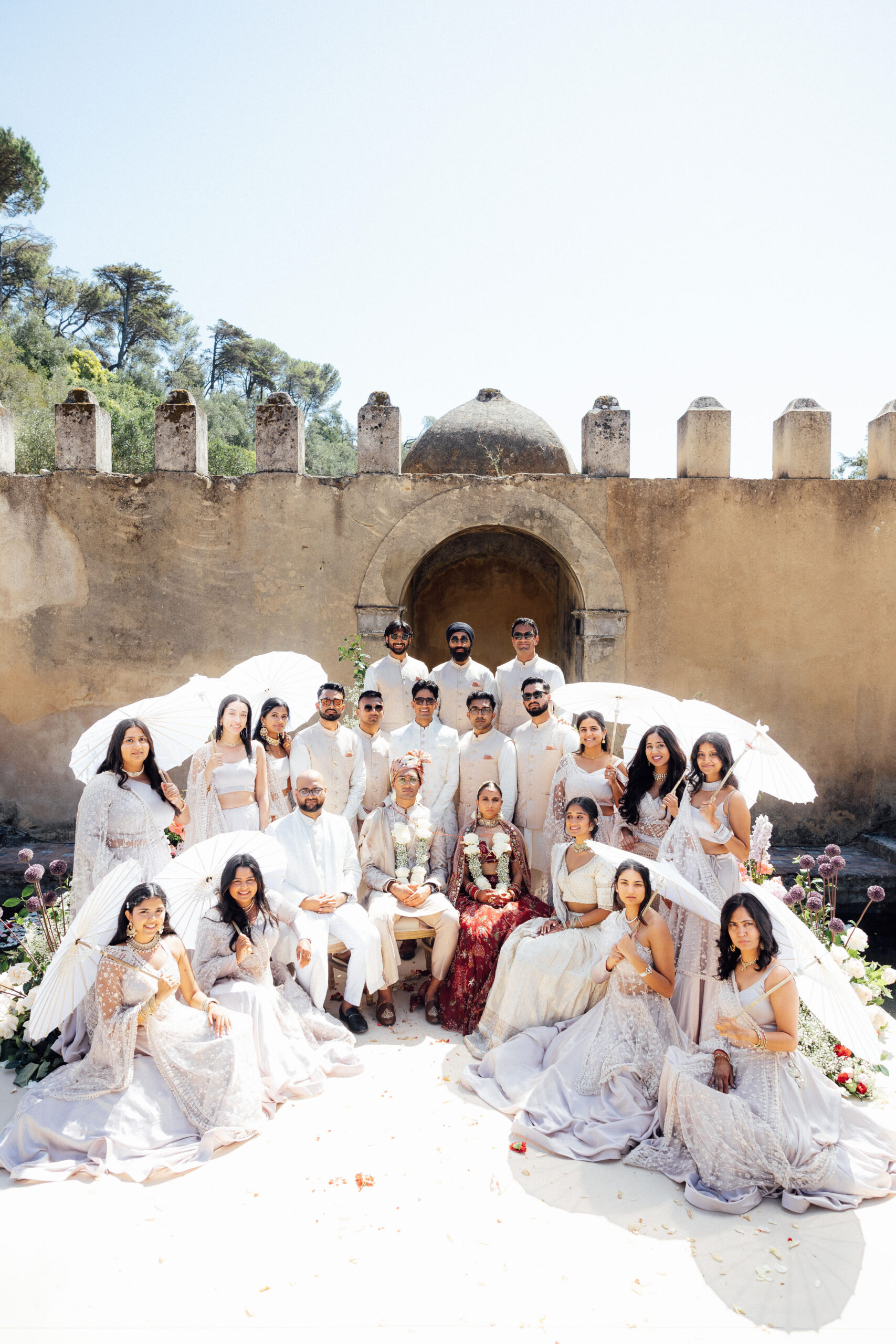 Wedding couple surrounded by family and friends, complete photograph